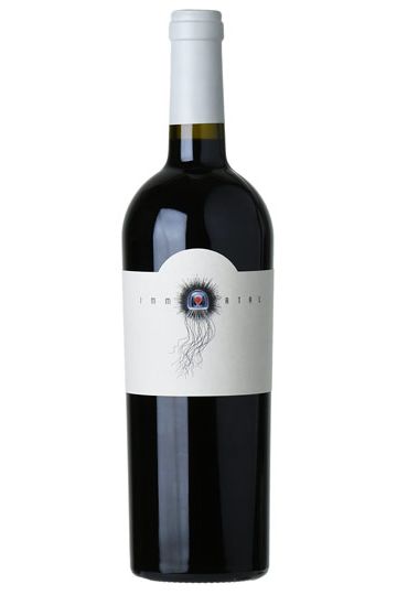 A bottle of Immortal Estate 2018 Slope Cabernet Sauvignon, Sonoma County wine with a white label and a depiction of a root system.