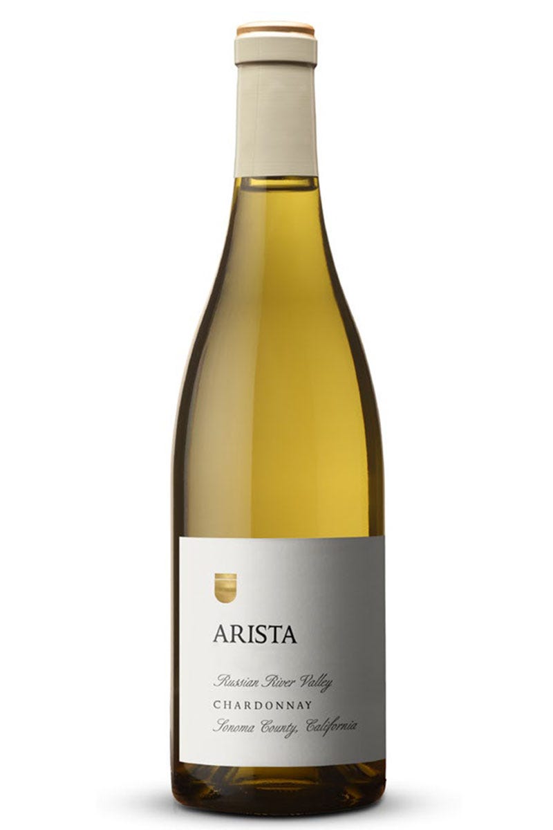 A bottle of Arista 2020 Ritchie Vineyard Chardonnay, Russian River Valley white wine with a label showing the brand, vineyard name, and wine type.